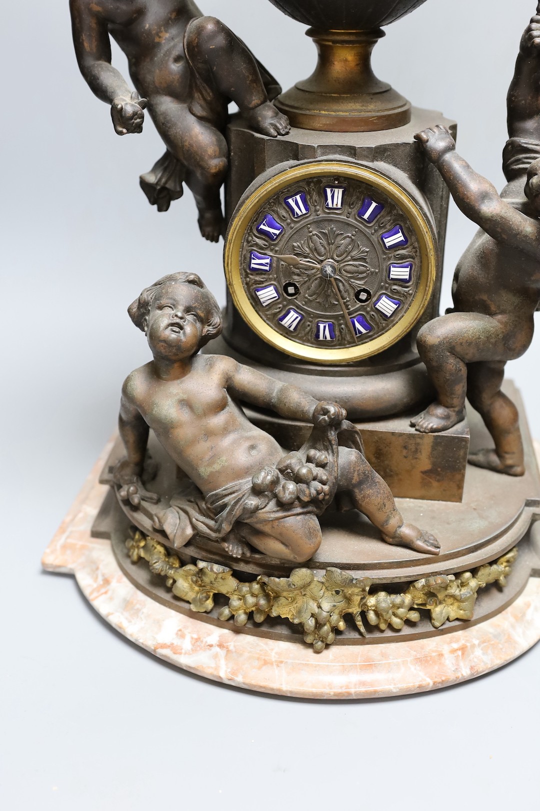 An early 20th century French bronzed spelter cherubic mantel clock 52cm